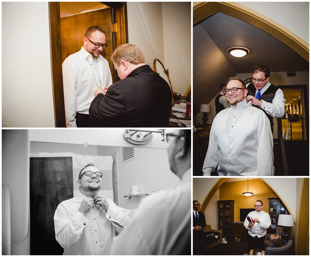 Groom getting ready for his wedding day with friends, buttoning shirt in the mirror. Brian + Michaels Oz Themed Wedding