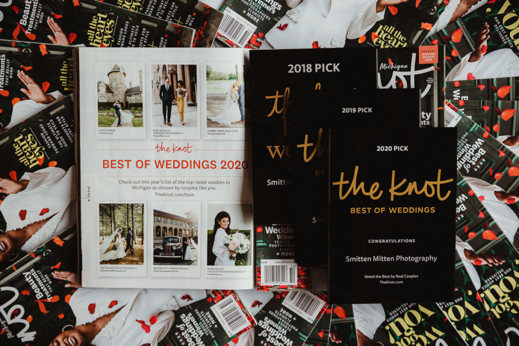 A pile of the knot magazines with one opened to The Best of Weddings 2020 feature next to a set of 3 plaques showing the last three years of wins. 

I've been published in The Knot