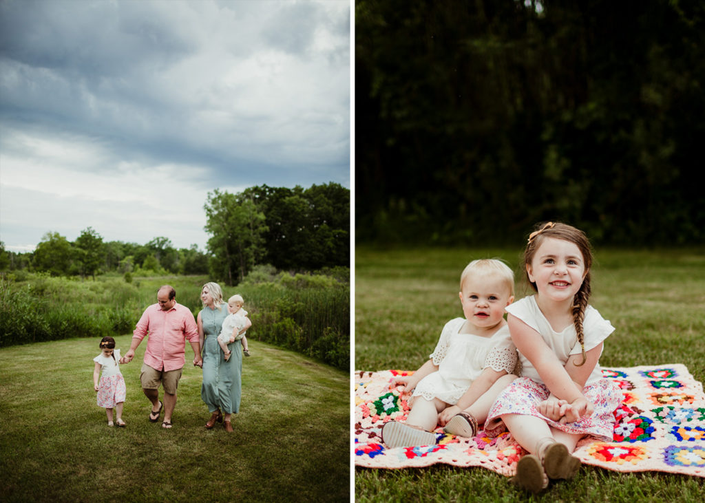 Family walking under a grey cloudy sky in the summer hand in hand while mom carries the baby, not looking at the camera. Two sisters sitting on a blanket smiling looking at the camera.  10 tips for choosing outfits for your family session